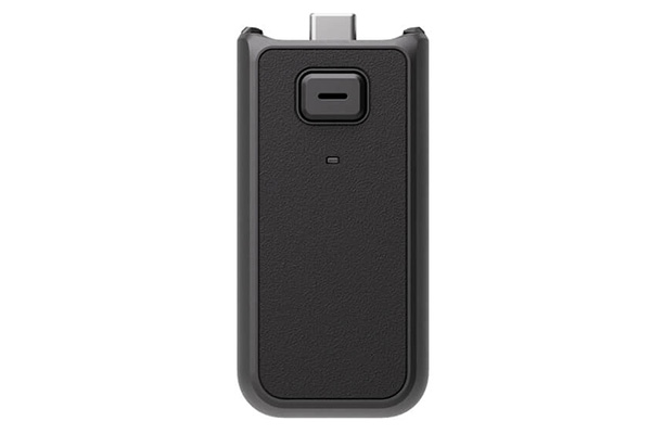 Black USB dongle with a textured back and a metal connector at the top used for data transfer or wireless pairing
